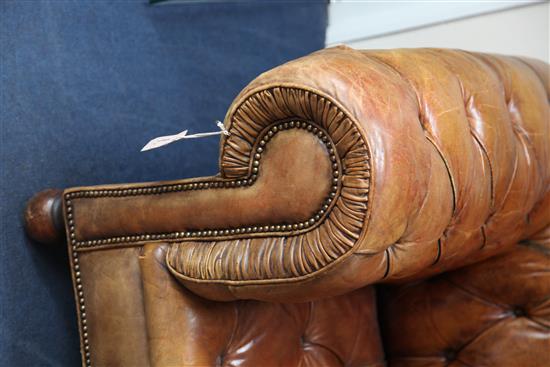 A brown leather buttoned Chesterfield settee, W.6ft 6in.